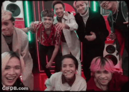Men Hugging In Front Of March Poster GIF
