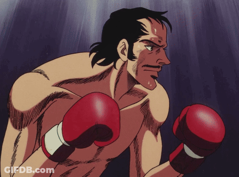 Men Hugging In Red And Black Boxing Gloves GIF