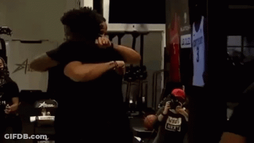 Men Hugging In Room GIF