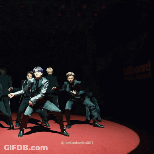 Men In Black Suits Performing On Red Carpet GIF