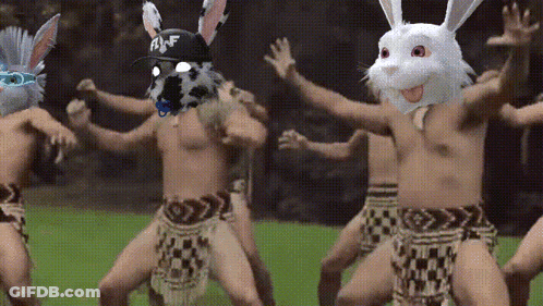 Men In Bunny Masks Dancing Together GIF
