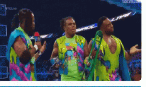 Men In Colorful Shirts On Stage GIF