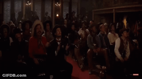 Men In Cowboy Hats Sitting In Dark Room GIF
