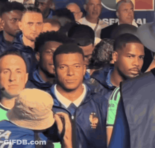 Men In Crowd, One Wearing Shirt Saying Fa GIF