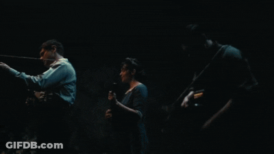 Men In Dark Hallway, One With Hat GIF