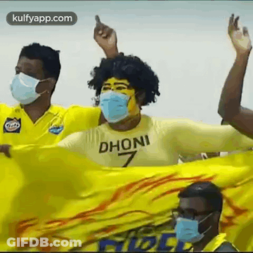 Men In Face Masks Holding Yellow Flag GIF