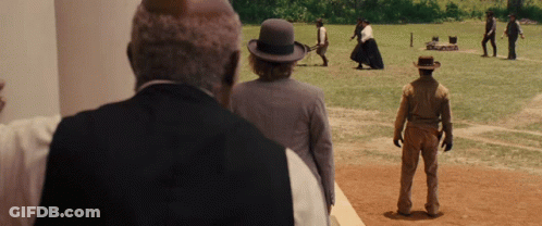 Men In Field, One With Bowler Hat GIF