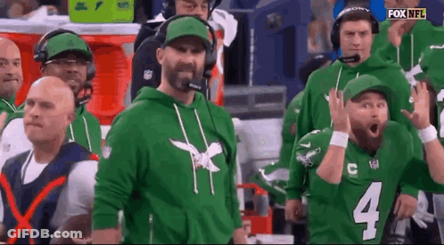 Men In Green Hoodies And Hats In Stadium GIF
