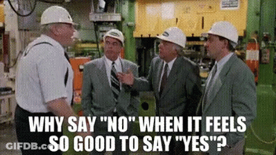 Men In Hard Hats Talking In Factory GIF
