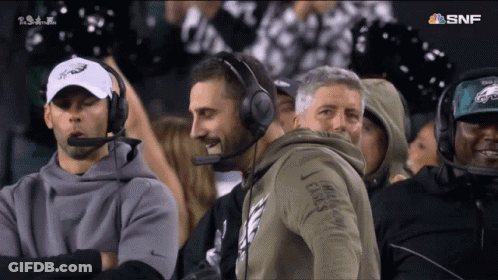 Men In Headphones Watching Football On NBC GIF