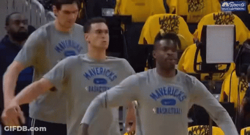 Men In Mavericks Shirts Standing In Line GIF