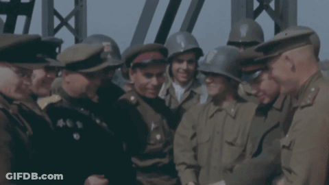 Men In Military Uniforms And Helmets Talking GIF