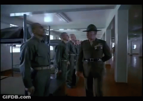 Men In Military Uniforms In Hallway GIF