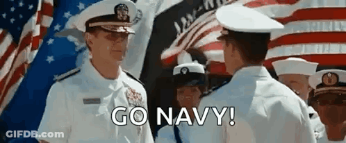 Men In Military Uniforms Standing Before American Flag GIF