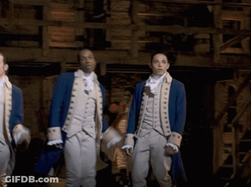 Men In Military Uniforms Standing In Dark Room GIF