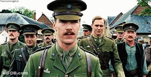 Men In Military Uniforms Walking Down Street The Hummingbird GIF