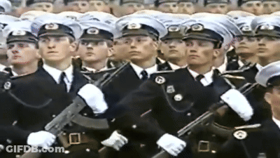 Men In Military Uniforms With B Hats GIF