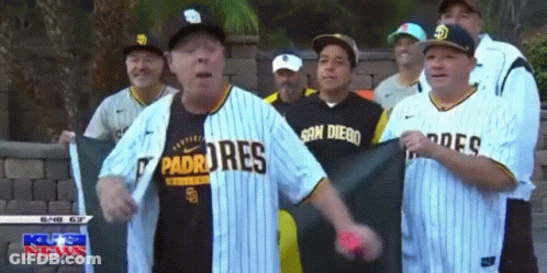 Men In Padres Jerseys In Front Of Brick Wall GIF