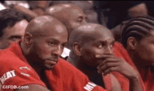 Men In Red Shirts Sitting In Stadium GIF