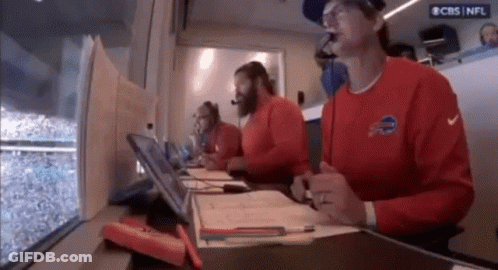 Men In Red Shirts With Buffalo At Table GIF
