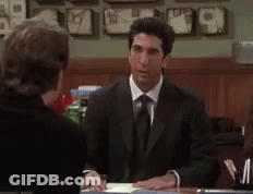Men In Suit Sitting At Table GIF