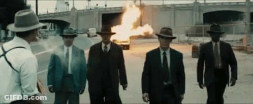 Men In Suits And Hats By Fire GIF