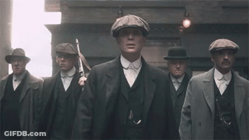 Men In Suits And Hats Standing On Street GIF
