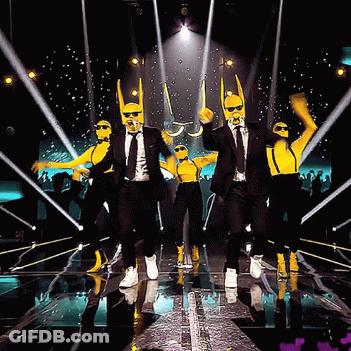 Men In Suits And Suspenders Dancing On Stage GIF