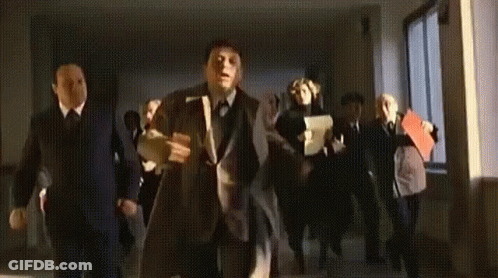 Men In Suits And Ties Dancing In Hallway GIF