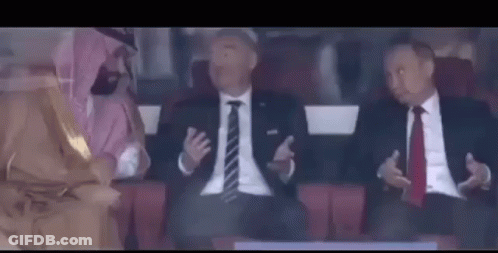 Men In Suits And Ties Sitting In Stadium GIF