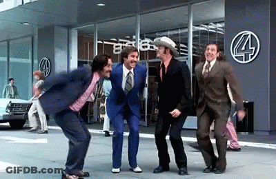 Men In Suits Dancing In Front Of Building GIF