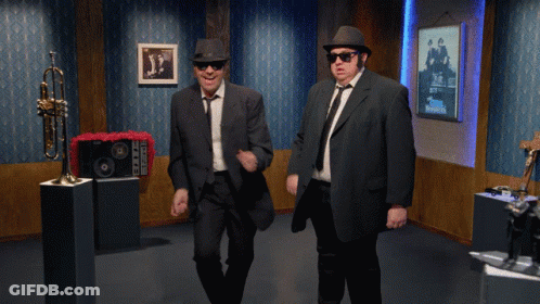 Men In Suits Dancing With Trumpet GIF