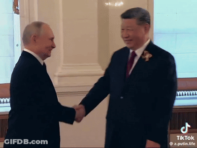 Men In Suits Shaking Hands GIF