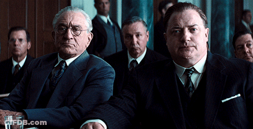 Men In Suits Sitting Around Table GIF