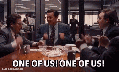 Men In Suits Sitting At Table With Ashes GIF