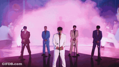 Men In Suits Speaking At Microphones GIF