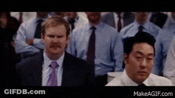 Men In Suits Standing Before Crowd GIF
