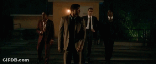 Men In Suits Standing In Dark Parking Lot GIF