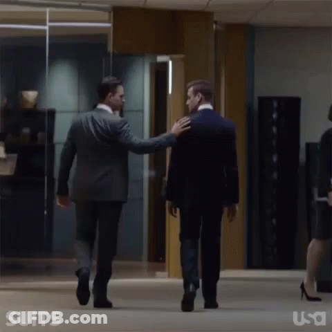 Men In Suits Walking Down Hallway GIF