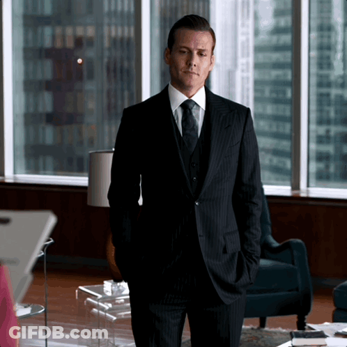 Men In Suits Walking Down Hallway GIF