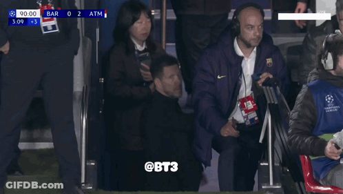 Men In Suits Walking Down Stadium Stairs Score 0 To 2 GIF