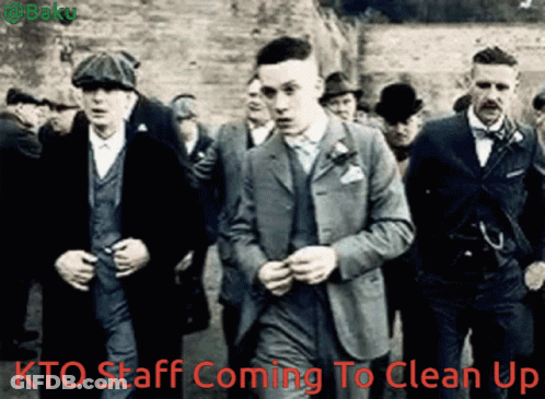 Men In Suits Walking With Kto Staff Coming To Clean Up GIF
