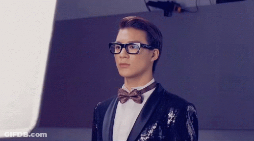 Men In Tuxedos And Suspenders Before Mirror GIF