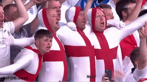 Men In White And Red Outfits With Cross GIF