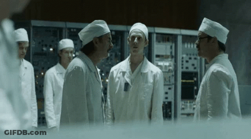 Men In White Coats And Hats Standing In Room GIF