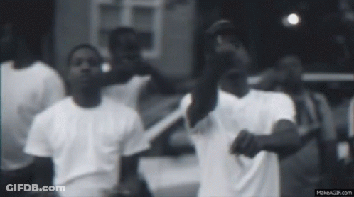 Men In White Shirts Standing In Front Of Car GIF