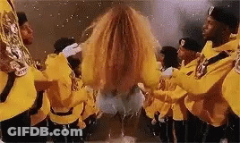 Men In Yellow Uniforms Playing Instruments GIF