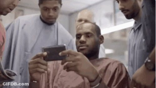 Men Looking At Cell Phone GIF