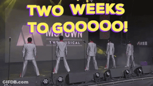 Men On Stage With Two Weeks To Gooooo Sign GIF