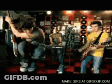 Men Playing Guitars Make Gifs At Gifsoup.com GIF